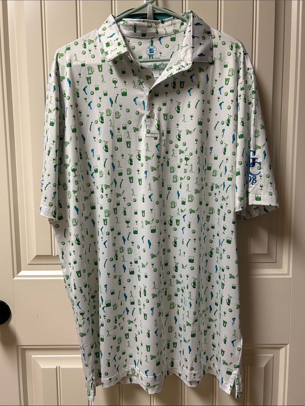 Coby Steven’s Classic White Polo with Green & Blue Mini Print